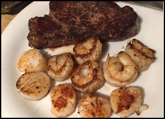 Beef tenderloin, shrimp and scallops nicely seared in butter