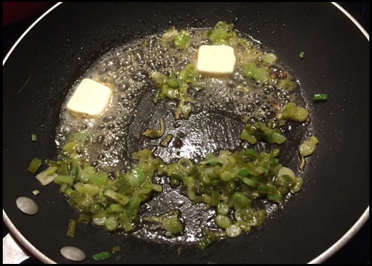 Scallions and garlic sauteing in butter