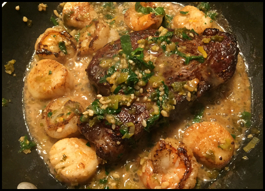 Add the beef tenderloins, shrimp, and scallops to the pan and spoon the sauce over everything