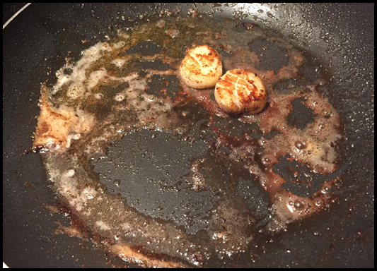 Last of the scallops sauteing in butter... my kitchen mate is quick with the spatula!